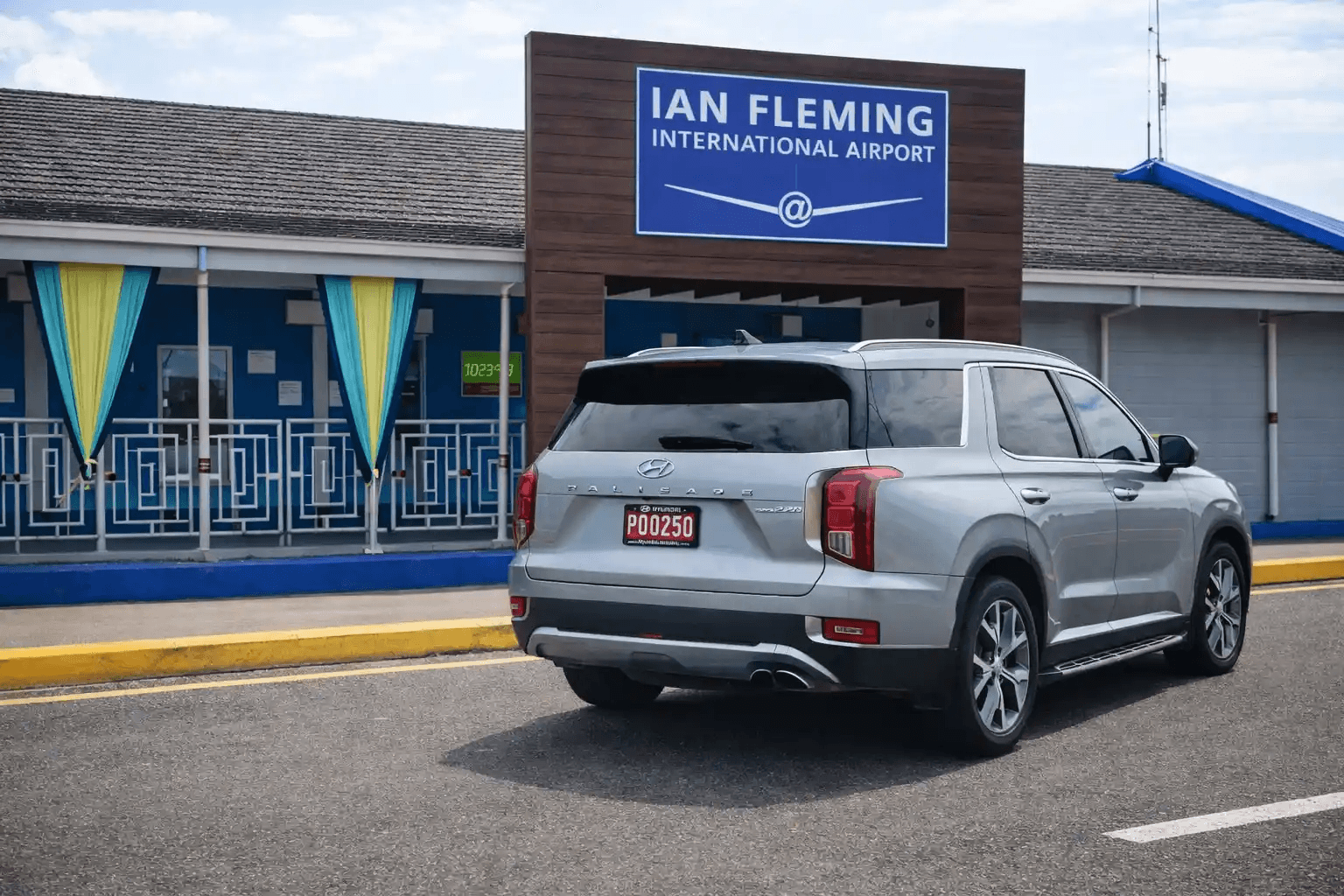 Guest being welcomed by Aurum Transfers driver with name board